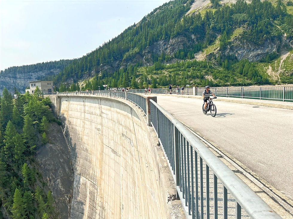 Bike cycling over Swiss dam
