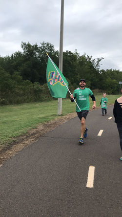 Tim running with the flag