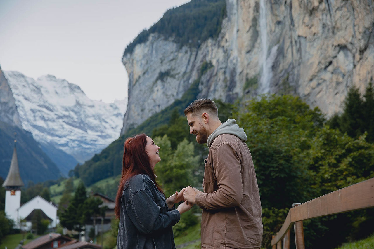 Emotional reaction to a surprise wedding proposal in Lauterbrunnen – captured by a Lauterbrunnen engagement photographer.