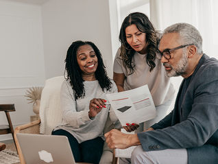 Family looking at financial statement representing planning together on saving for retirement.