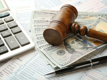 Calculator, gavel, and money symbolize new tax law impacts from the One Big Beautiful Bill, signed into law July 4