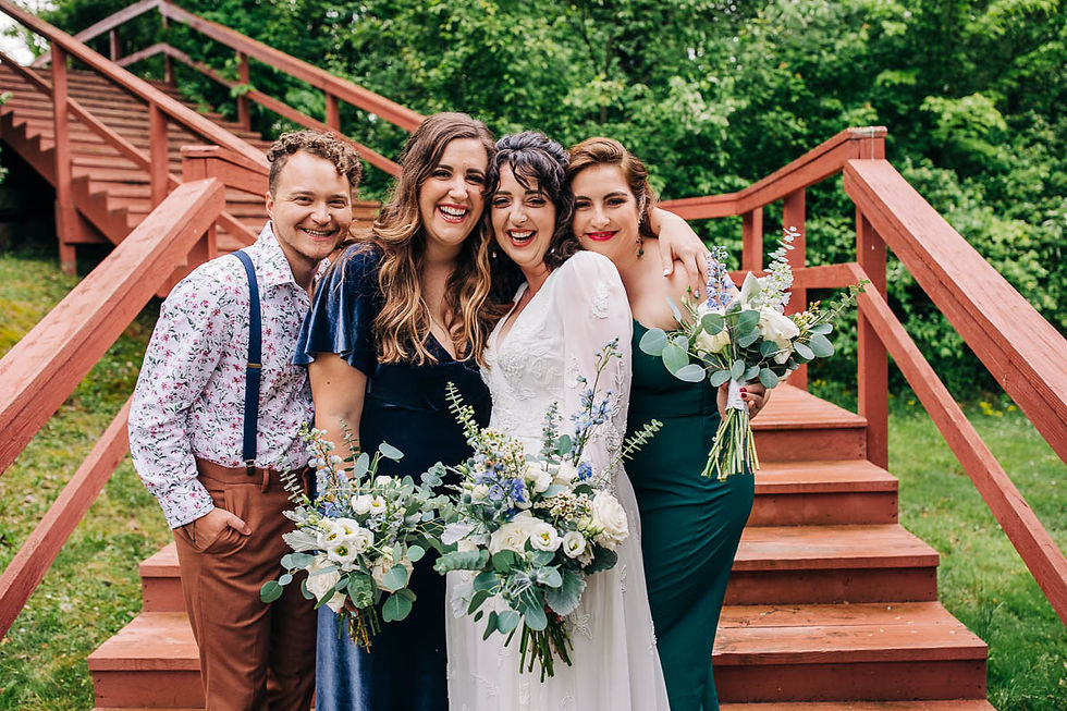 A bride with her bridesmaids on her wedding day at Perlstein Resort in Wisconsin Dells captured by Milwaukee wedding photographer.