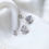 Thumbnail: Twisted knot moissanite stud