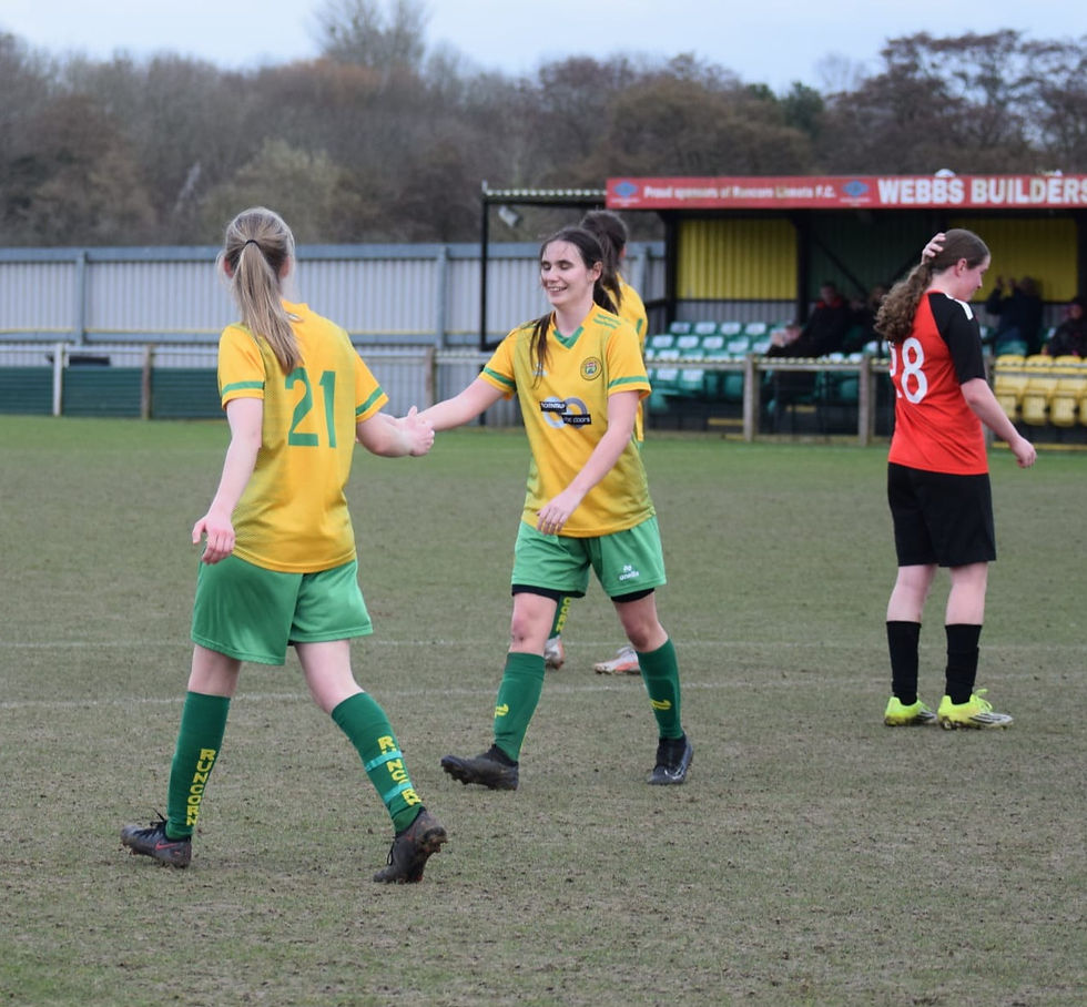 Emma Smith (No 21) is congratulated on her goal by Jess Bazley
