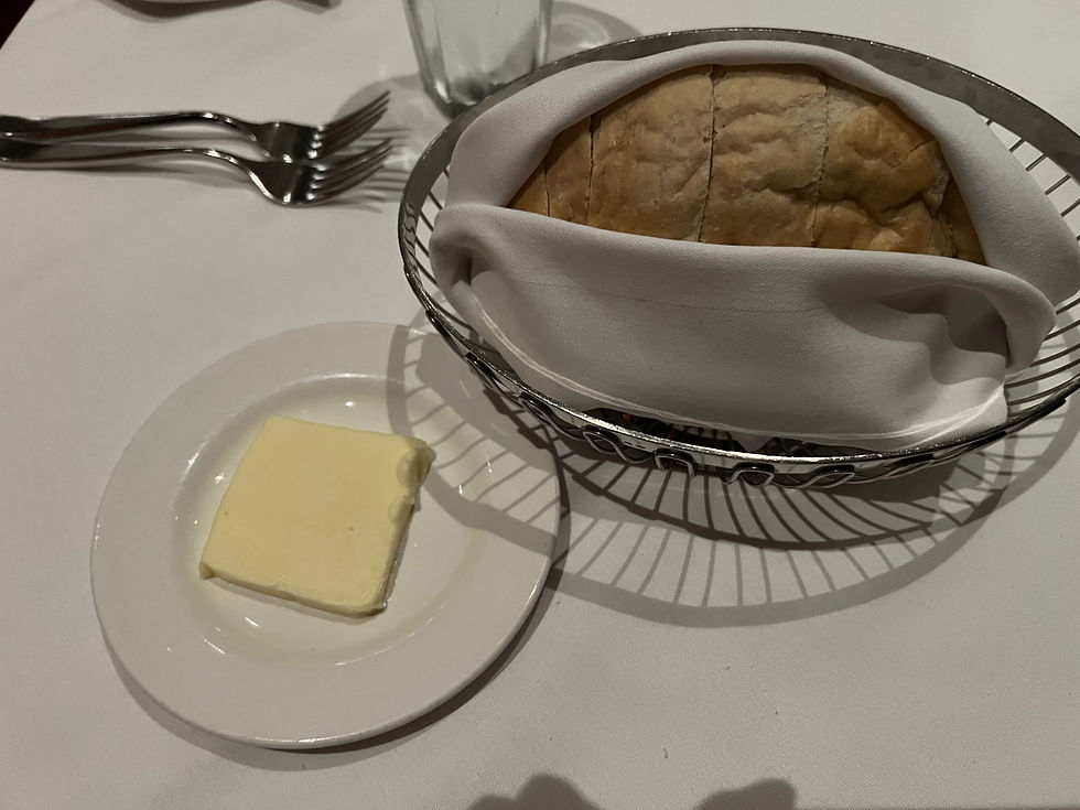 Sourdough bread loaf with regular butter