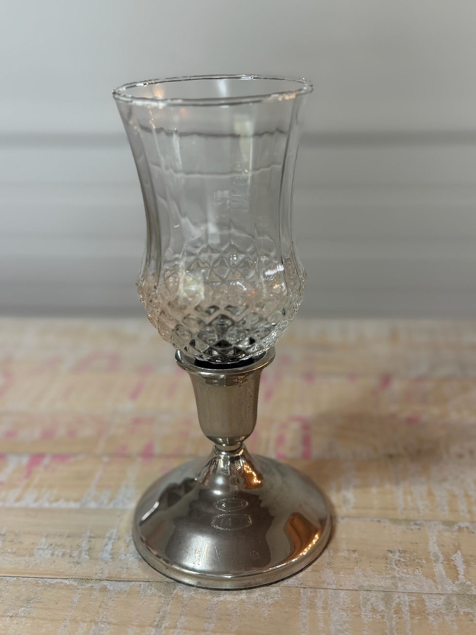 Thumbnail: Silver candle holder with a patterned glass cup