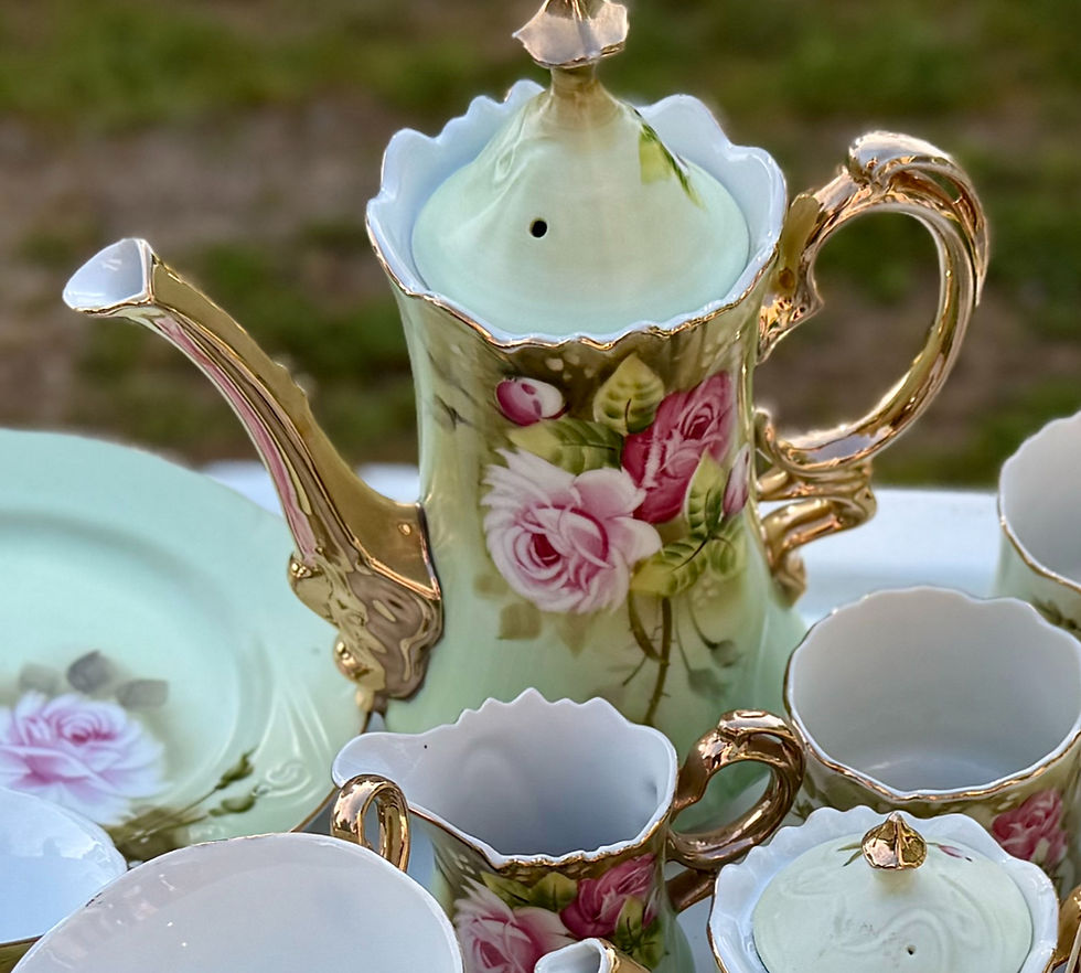 Thumbnail: Light green teapot with gold trim and pink roses, part of a tea set.
