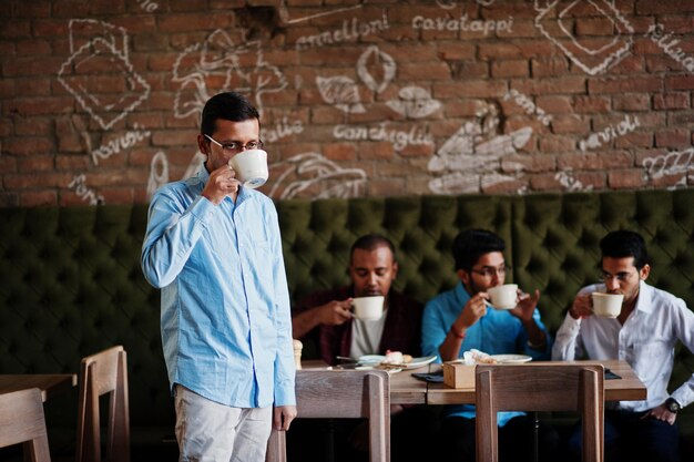 group-four-south-asian-mens-posed-business-meeting-cafe-indians-work-together-having-conve
