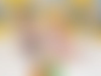 Two young children joyfully indulge in a colorful birthday cake, surrounded by festive blue and yellow balloons and playful rubber duck decorations.