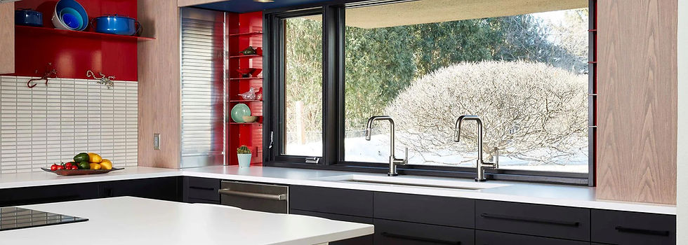 Modern kitchen, large European Tilt and Turn window, white counters, black cabinets.