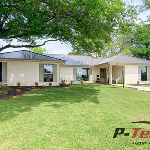 Single-story house with a green lawn and many P-Tek windows