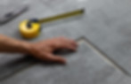 Flooring recoverer placing carpet tiles together