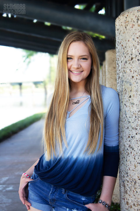 Smiling young woman with long blonde hair