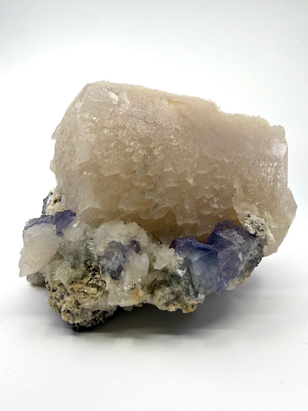 Thumbnail: Calcite “Tooth” with Purple Fluorite