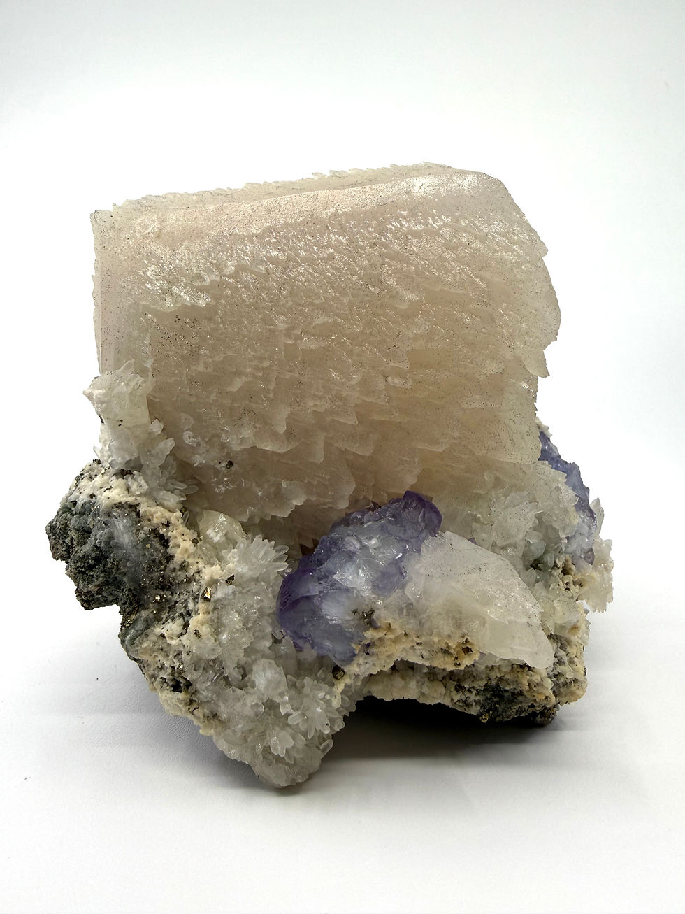 Thumbnail: Calcite “Tooth” with Purple Fluorite