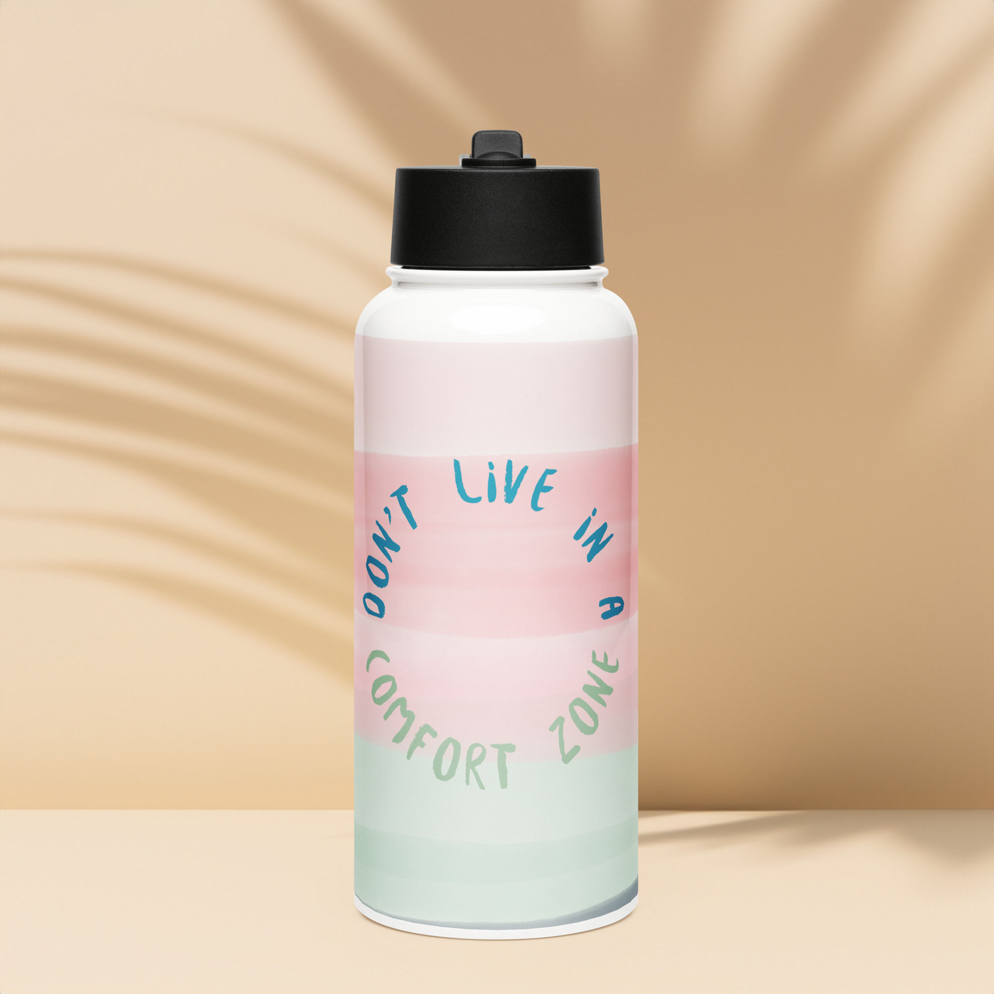 Pink, green, and white water bottle with 'DON'T LIVE IN A COMFORT ZONE'