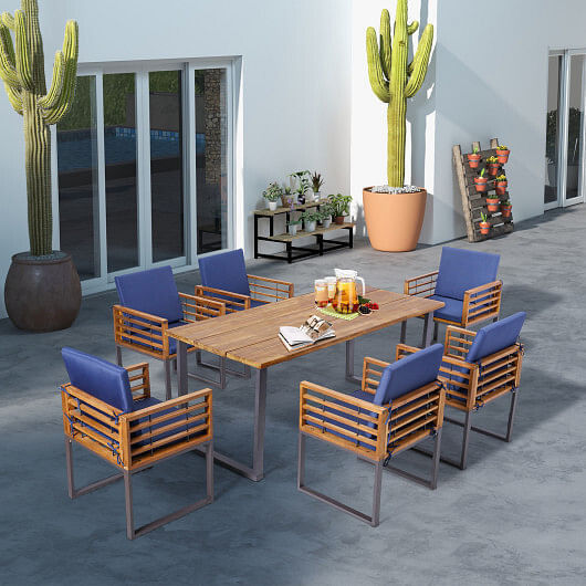 Wooden outdoor dining set with blue cushions