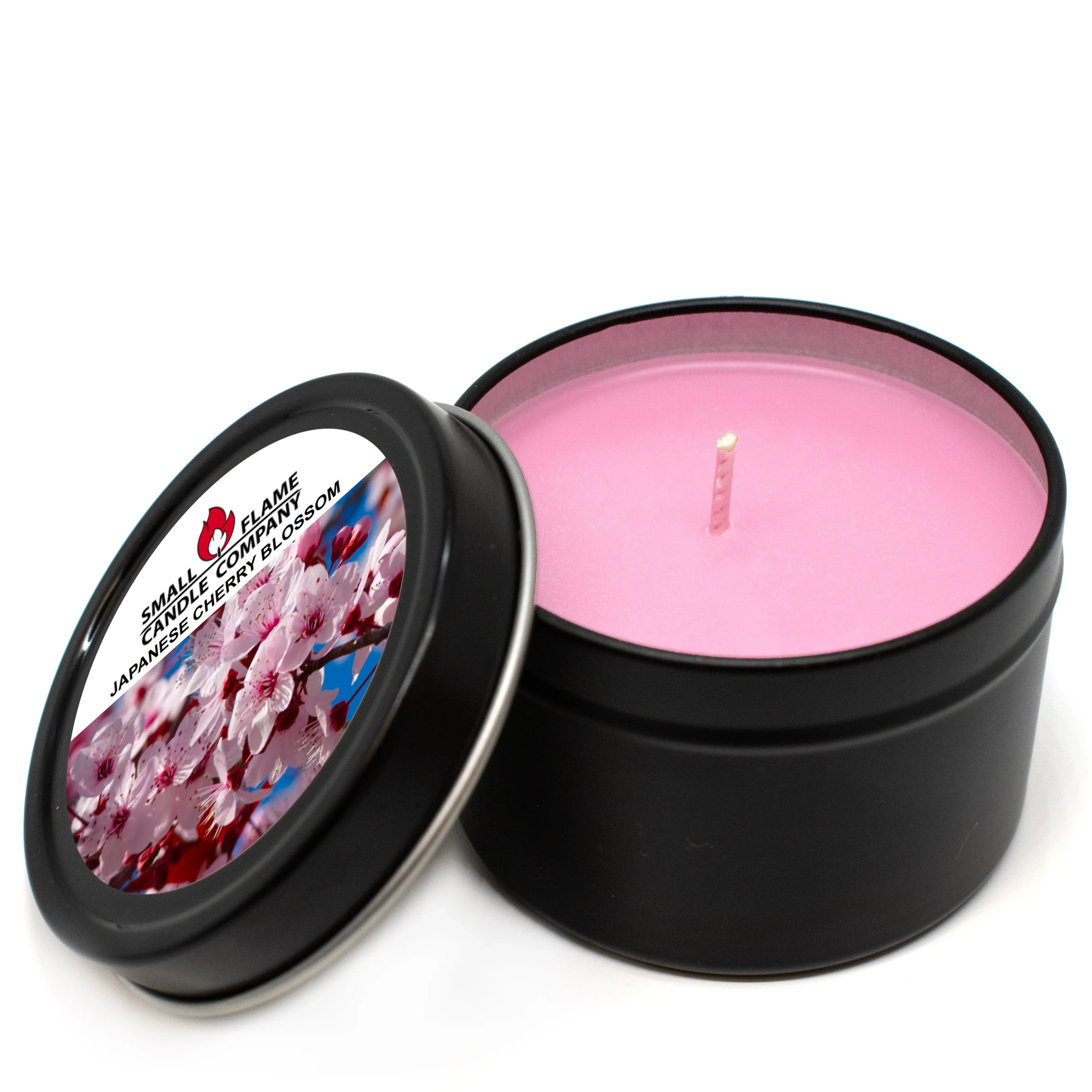 Pink candle in open black tin, Japanese cherry blossom