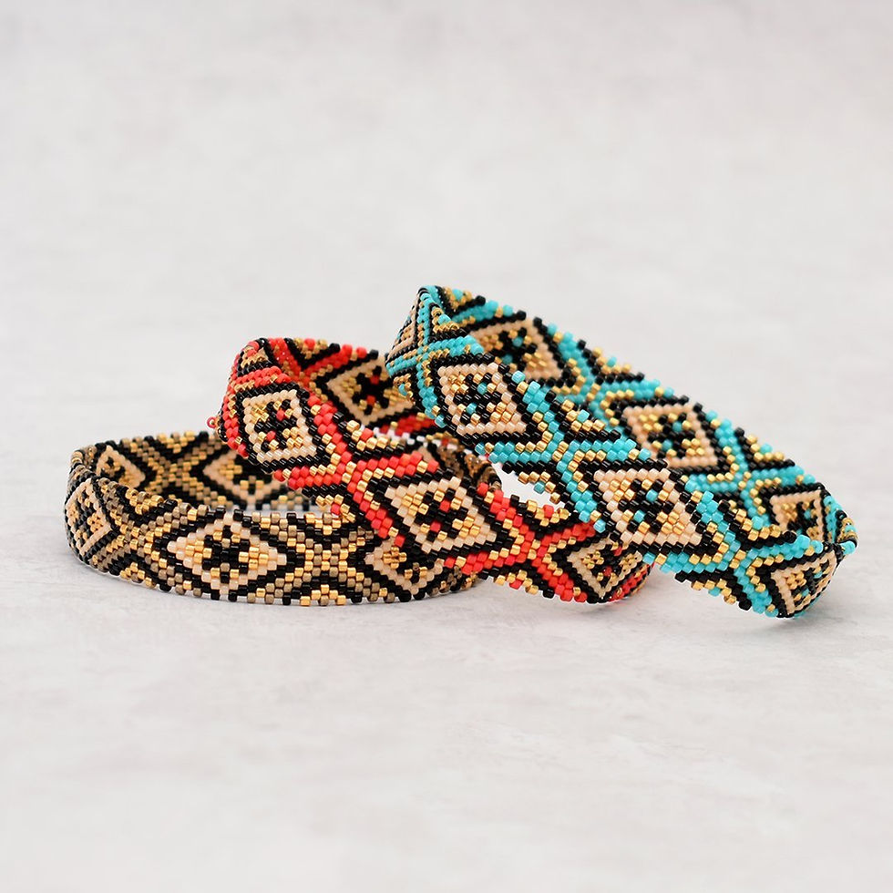 Two woven bracelets, one red, one blue, with patterns.