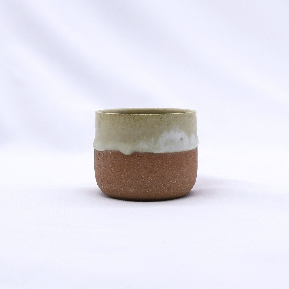 Handcrafted ceramic cup, brown with creamy white glaze