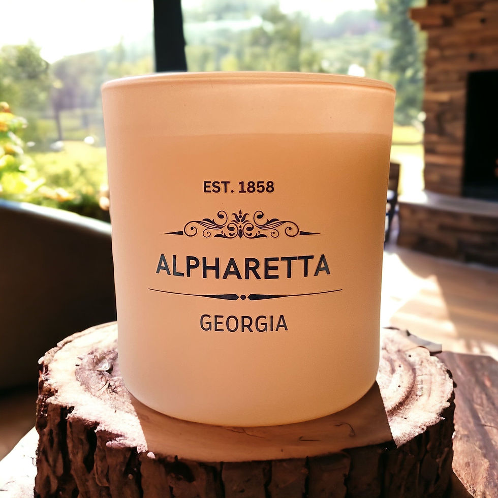 Candle with 'EST. 1858 ALPHARETTA GEORGIA' text, on wood slice