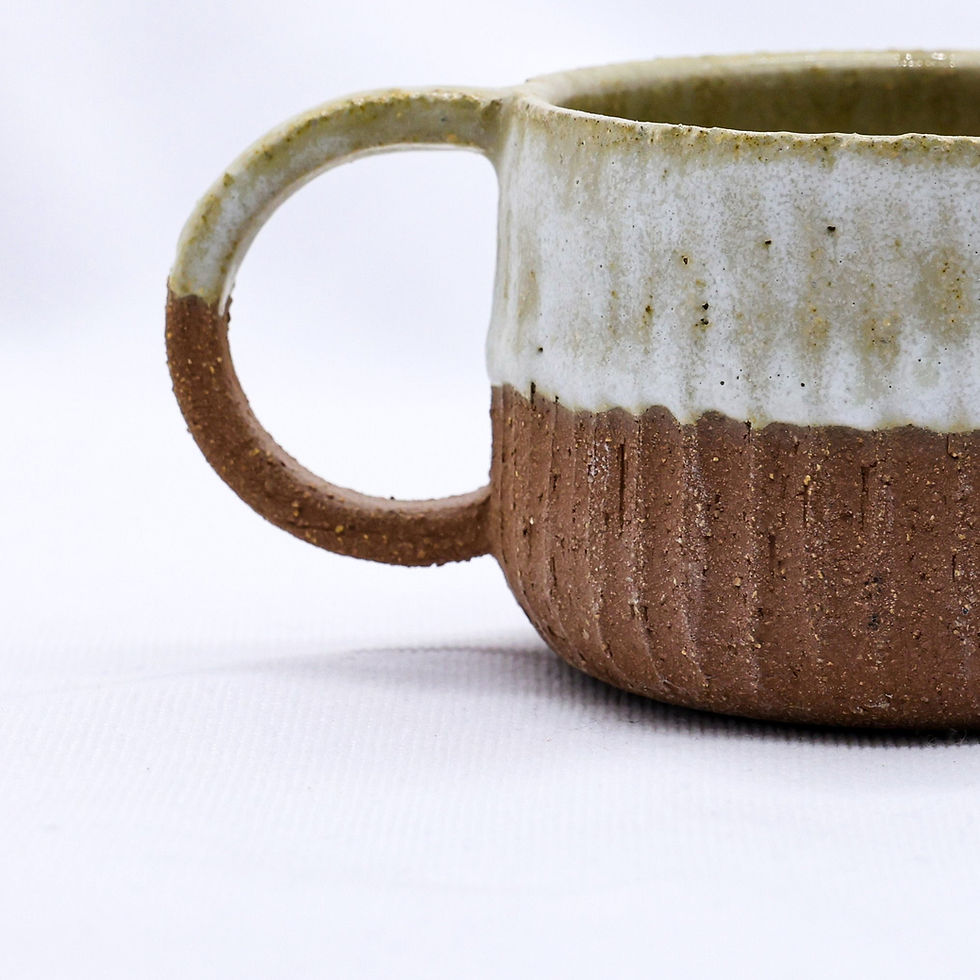 Two-tone ceramic mug with brown textured base and light top