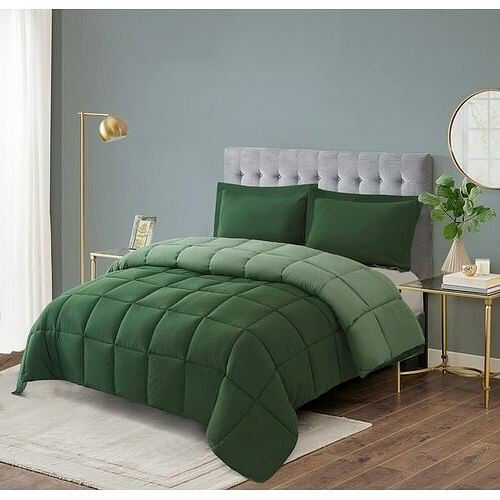 Green bed comforter and pillows in a modern bedroom
