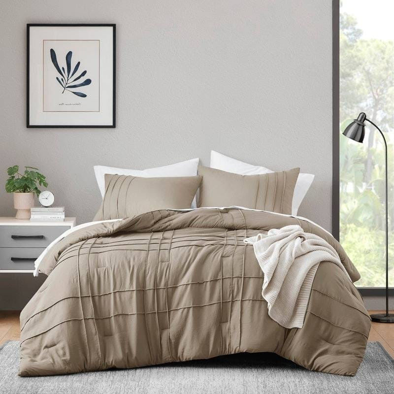 Brown comforter set on a bed in a modern bedroom