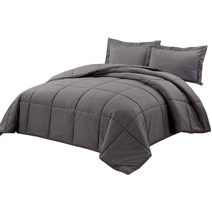 Gray comforter with two pillows