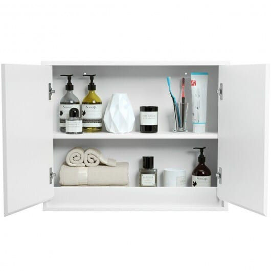 White two-door cabinet with open doors filled with toiletries and towels