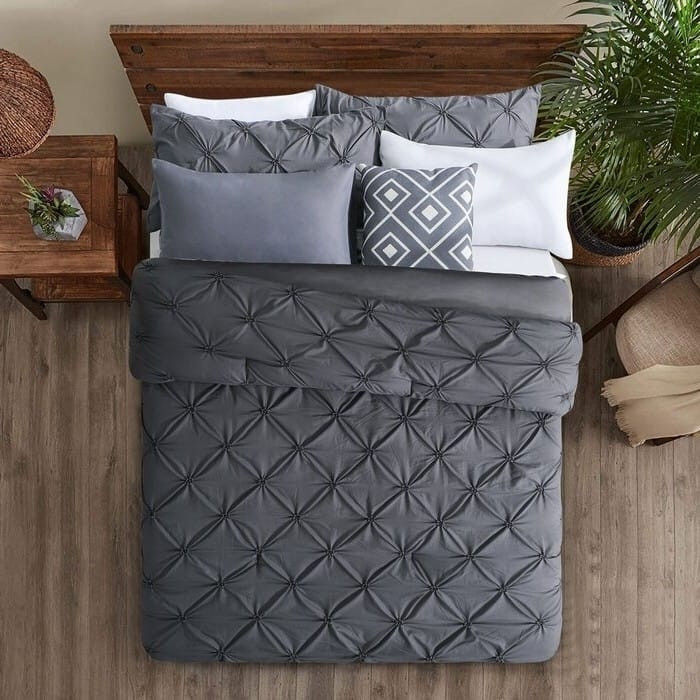 Modern farmhouse bed with dark grey comforter