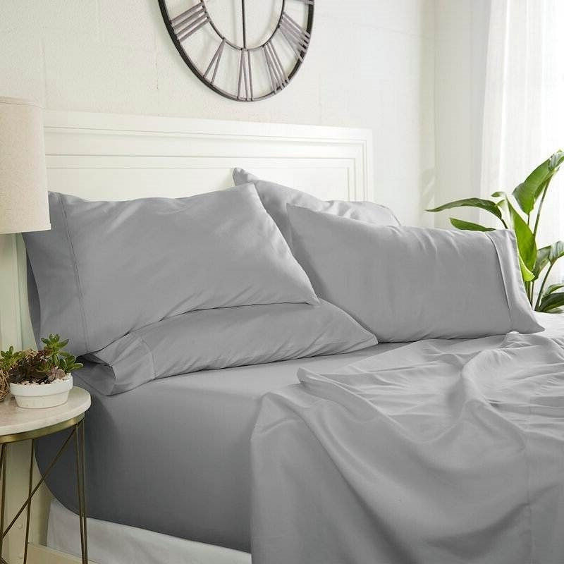 Bed with gray sheets and pillows