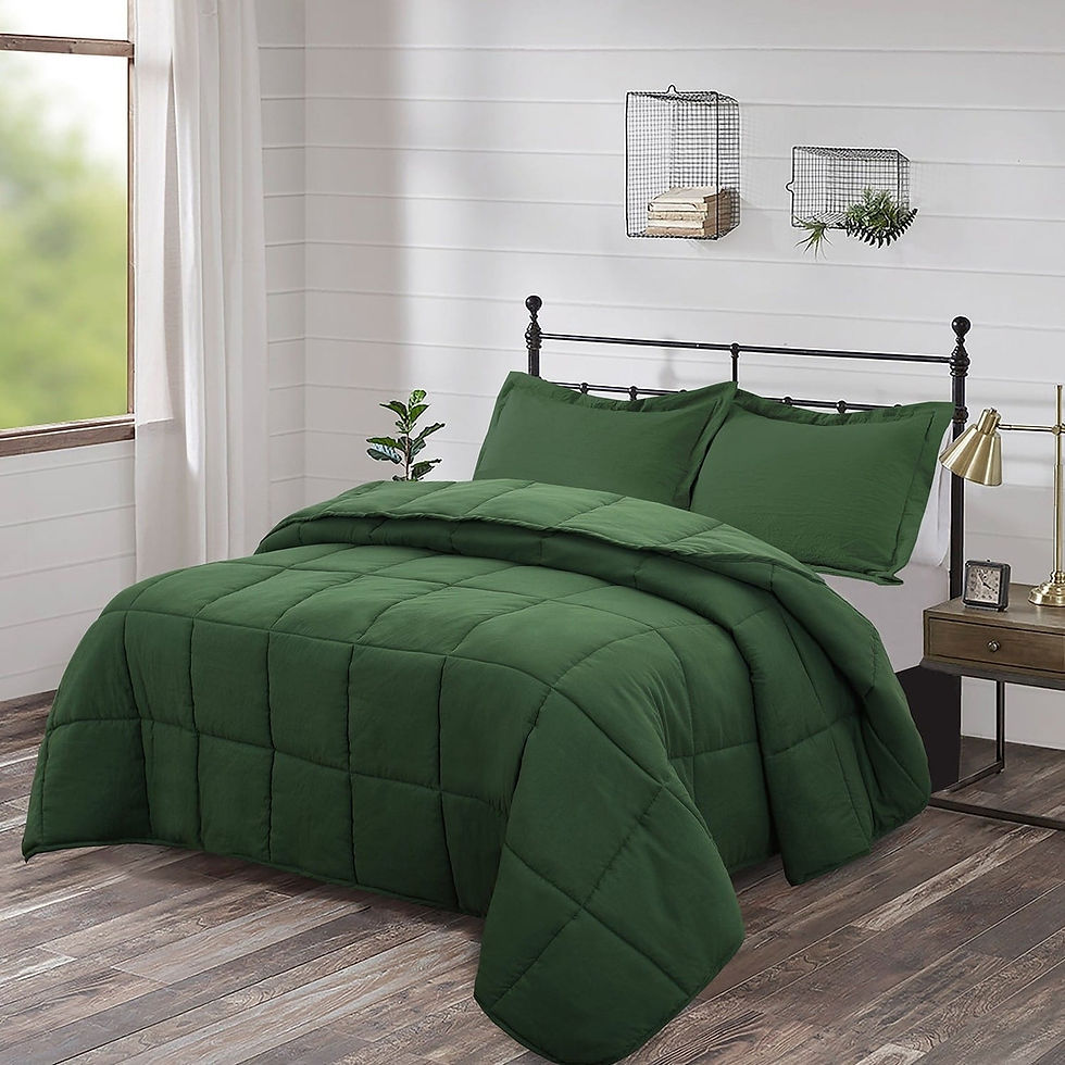 Bed with dark green comforter and pillows