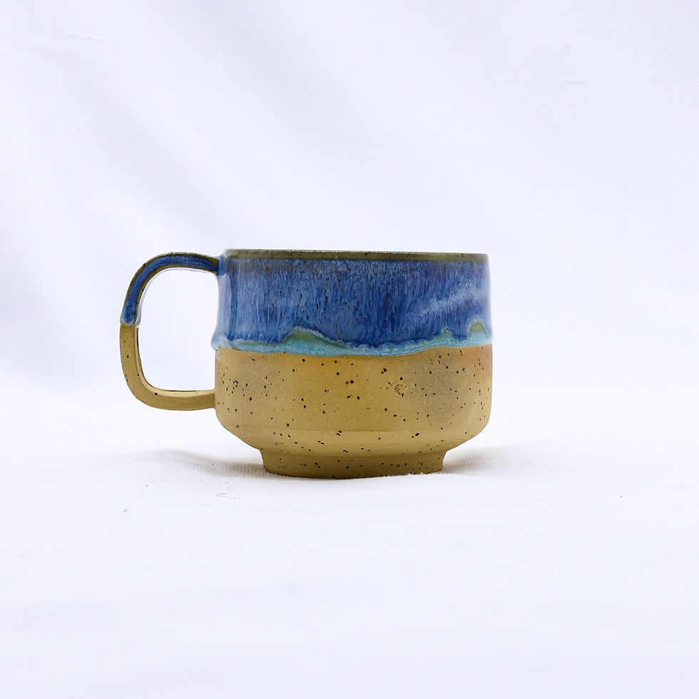 Two-tone ceramic mug, speckled tan and blue glaze