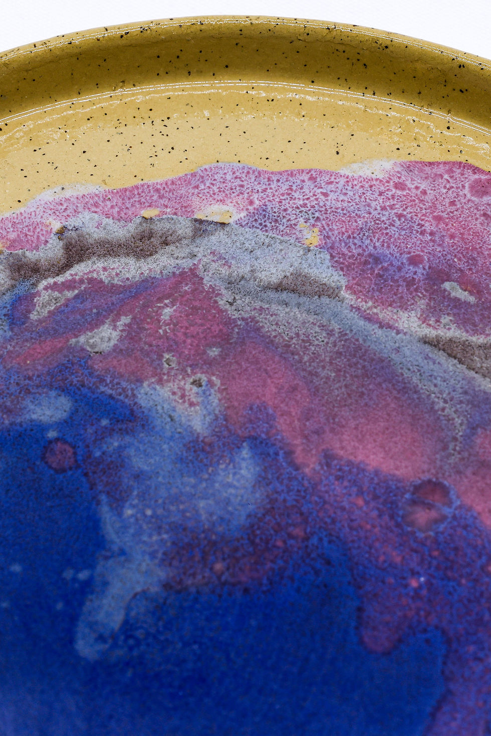 Bubbly abstract pattern in blue, purple, pink, and gold.