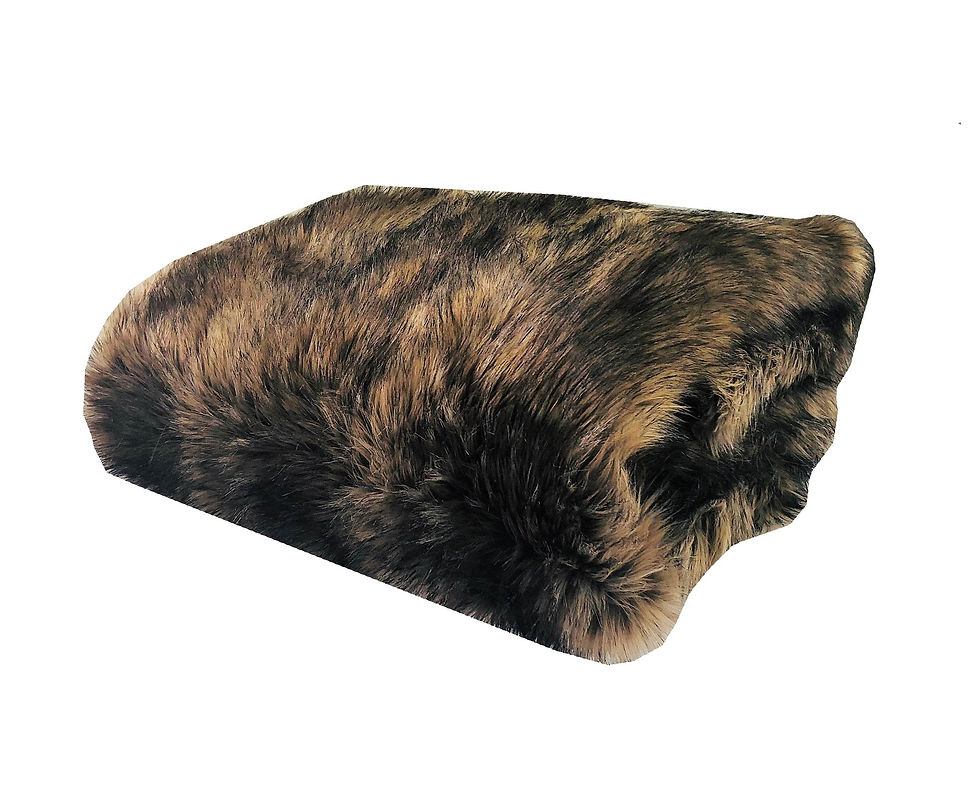 Folded mottled brown and black furry blanket