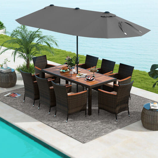 Outdoor dining set with 8 wicker chairs and umbrella by pool