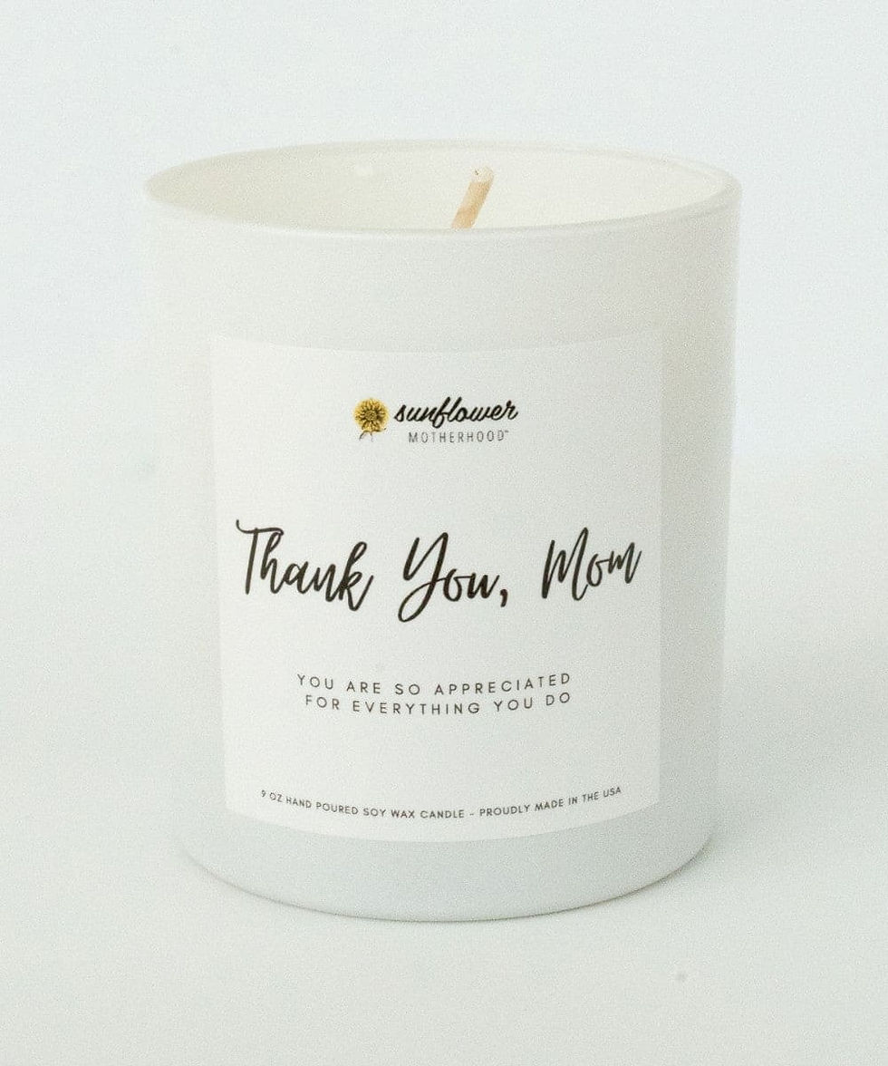White candle with 'Thank You, Mom' label