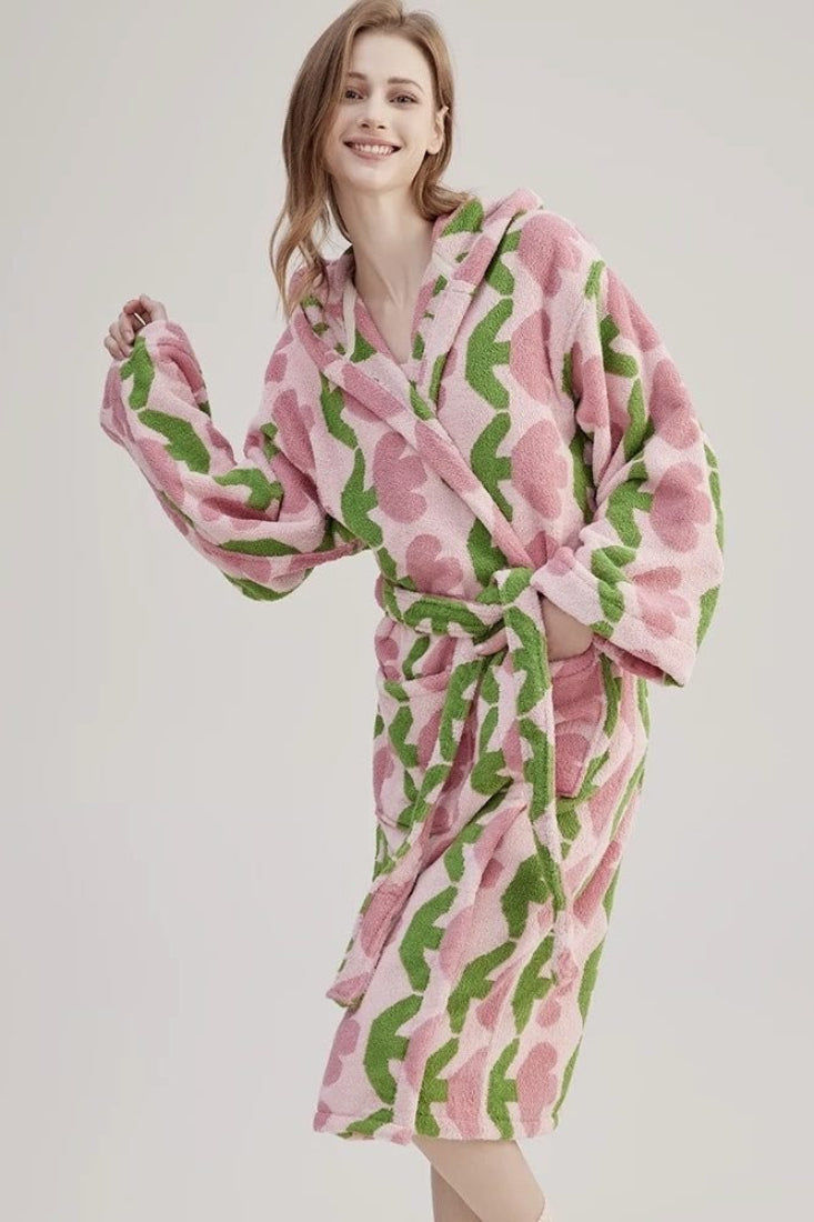 Person in a pink and green patterned bathrobe