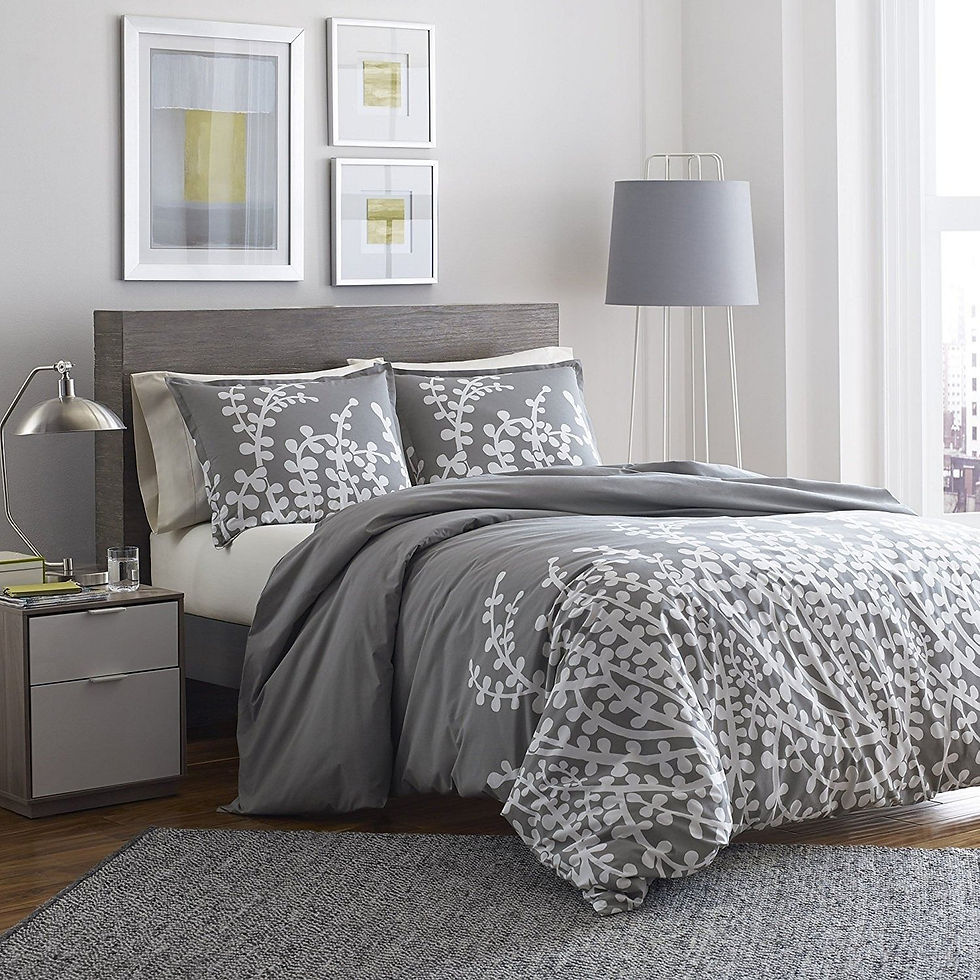 Modern bedroom with gray bedding and white leaf pattern