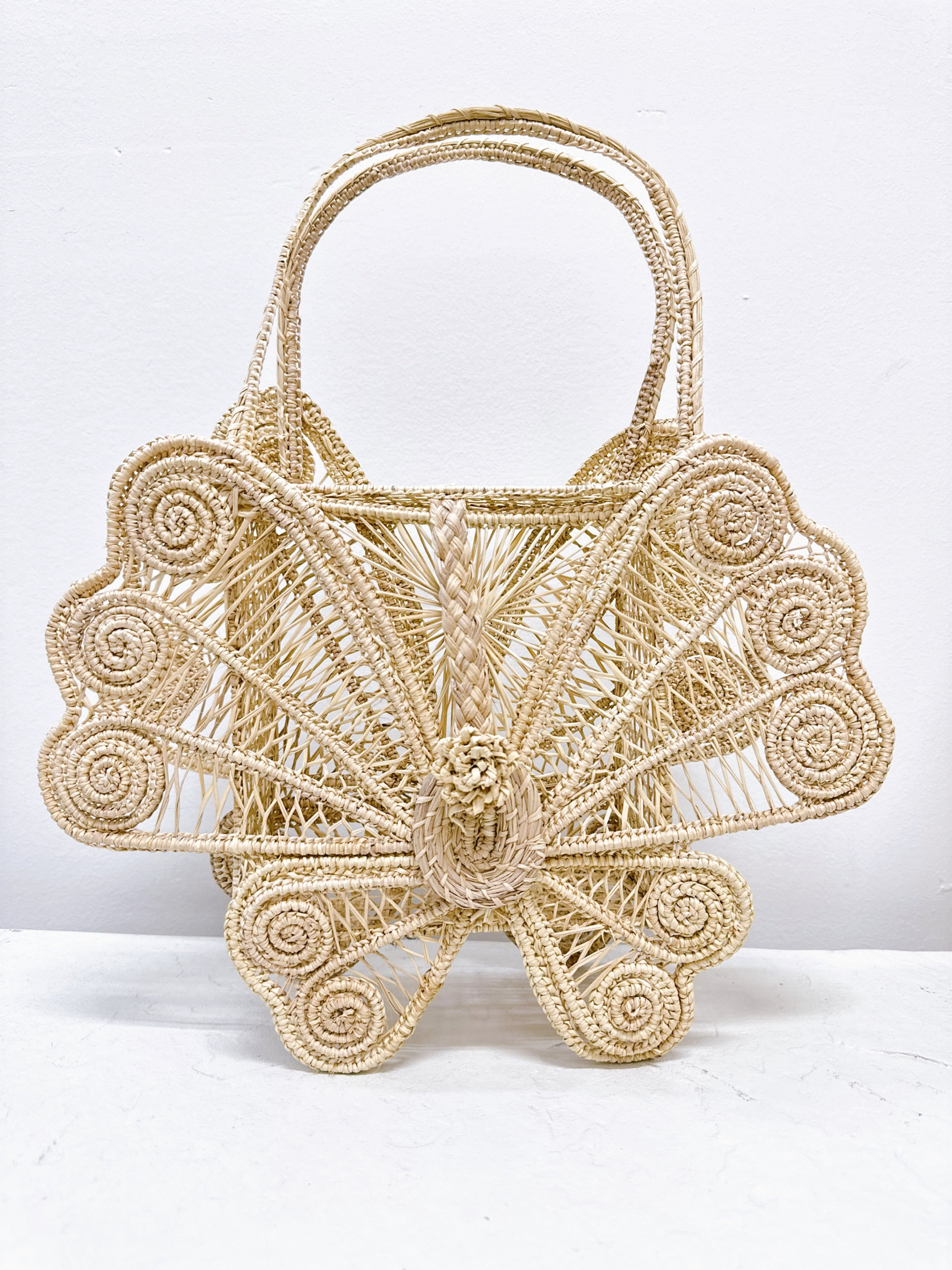 Woven bag with intricate fan-like design