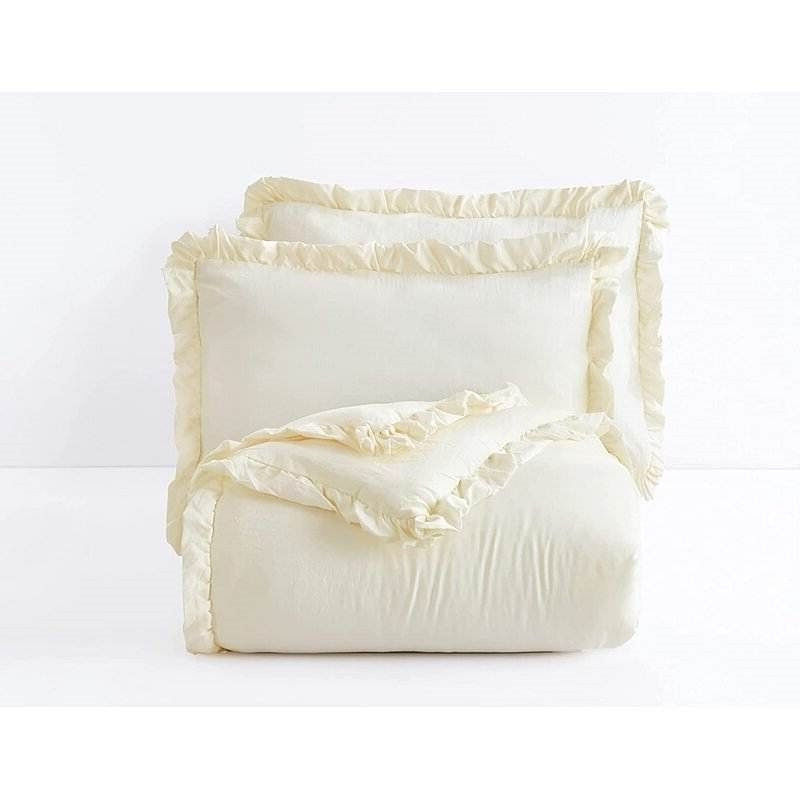 Off-white ruffled comforter and pillow shams