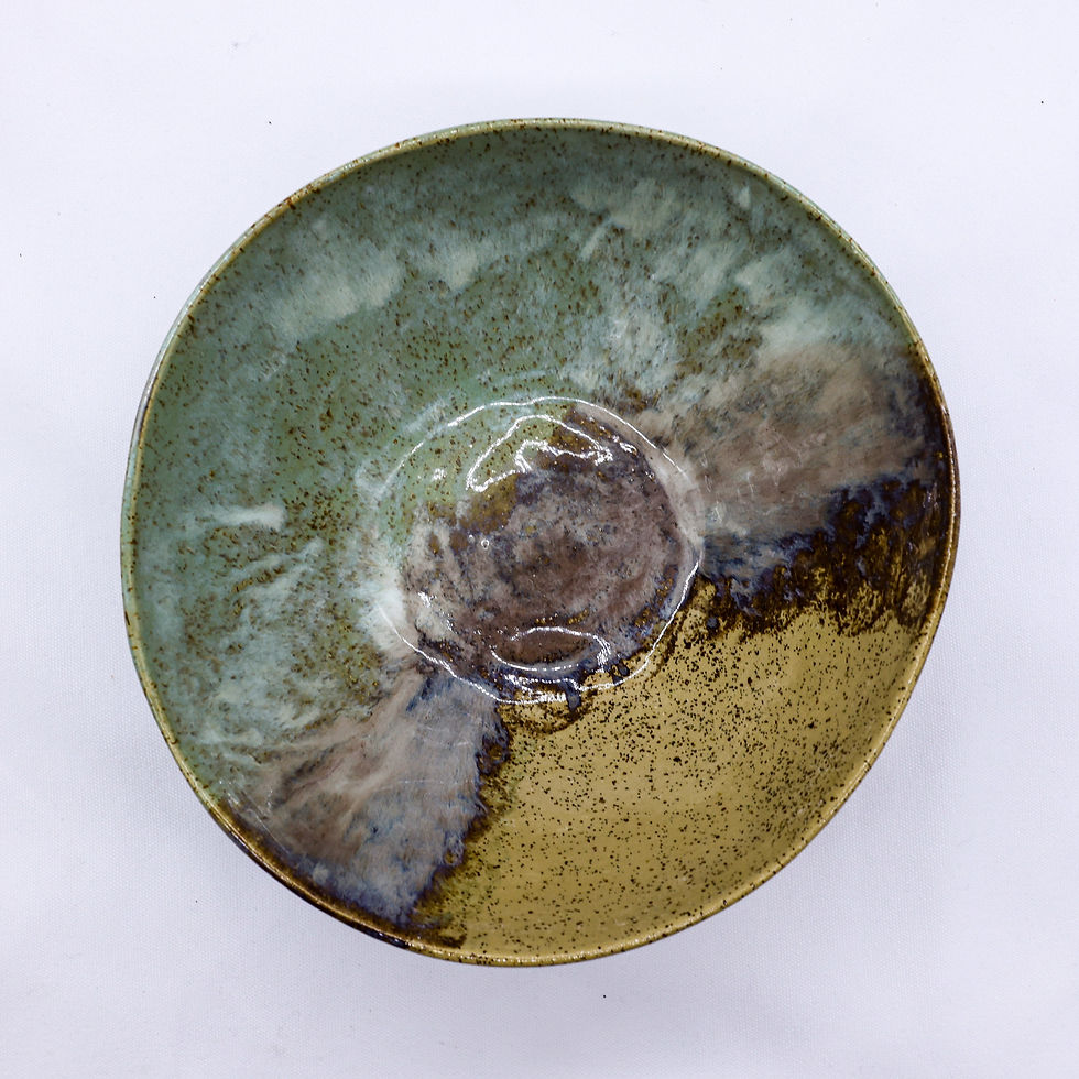 Handmade ceramic dish with green, brown, and gold glaze