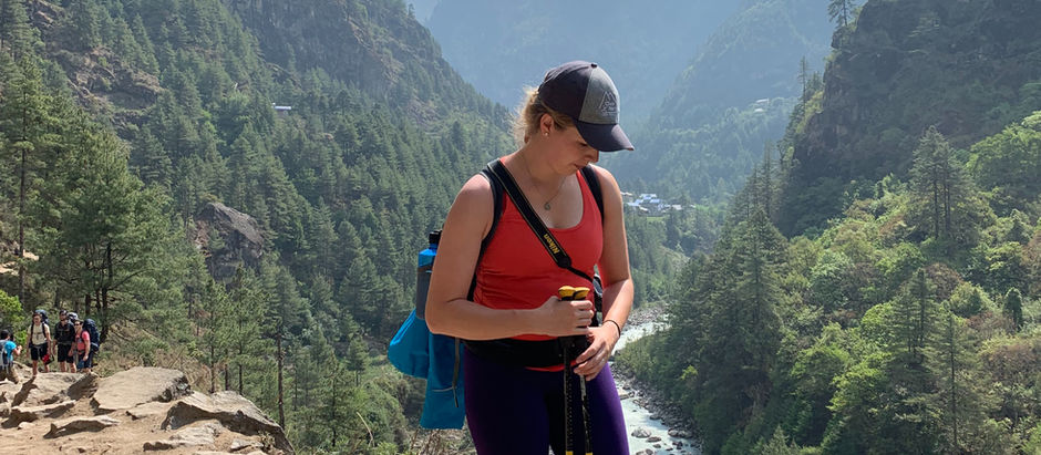 A woman stands in the Himalyan Mountains