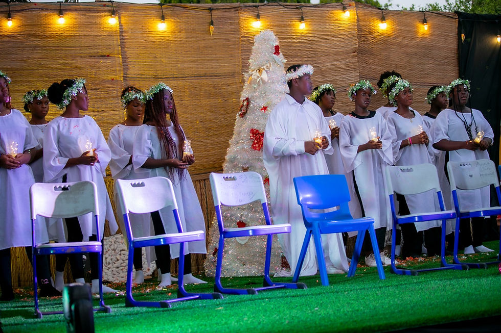 Students in white robes at Montessori school campus Accra.