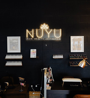 nuyu sign and nail table.jpg