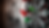 Dartboard with red and green darts, wall in background. Darts cluster near bullseye, evoking tension, focus, and accuracy.