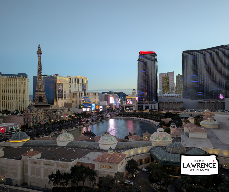 Cityscape of Las Vegas at dusk, featuring the Eiffel Tower replica and illuminated buildings. Text on image: From Lawrence with Love.