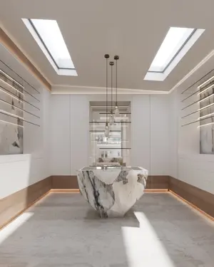 Render of the main dressing room with marble island, timber accents, and skylight illumination.