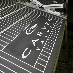 North Carolina synthetic teak decking project with custom logo inlay.